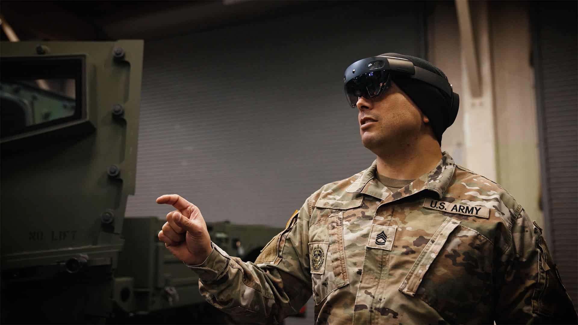 U.S. Army soldier directing work with a HoloLens 2 headset