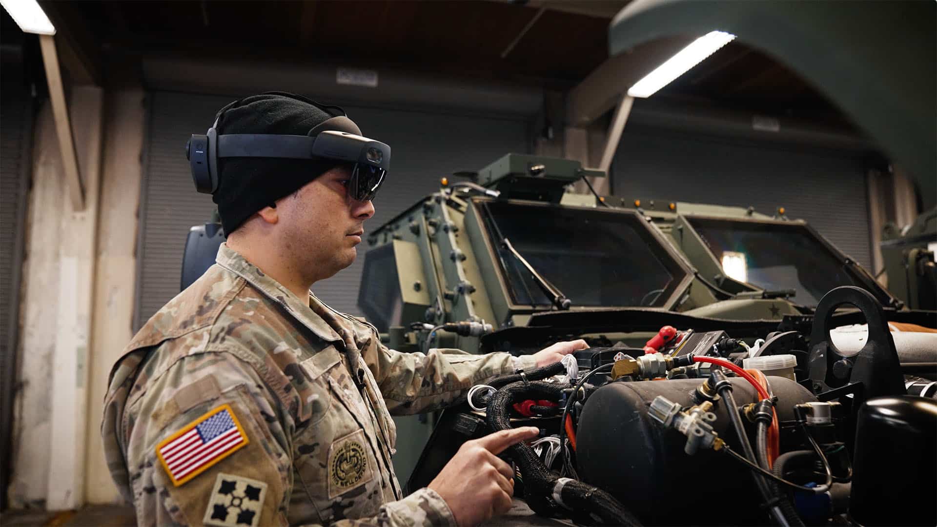 U.S. Army soldier executing an approved maintenance procedure with a HoloLens 2 headset